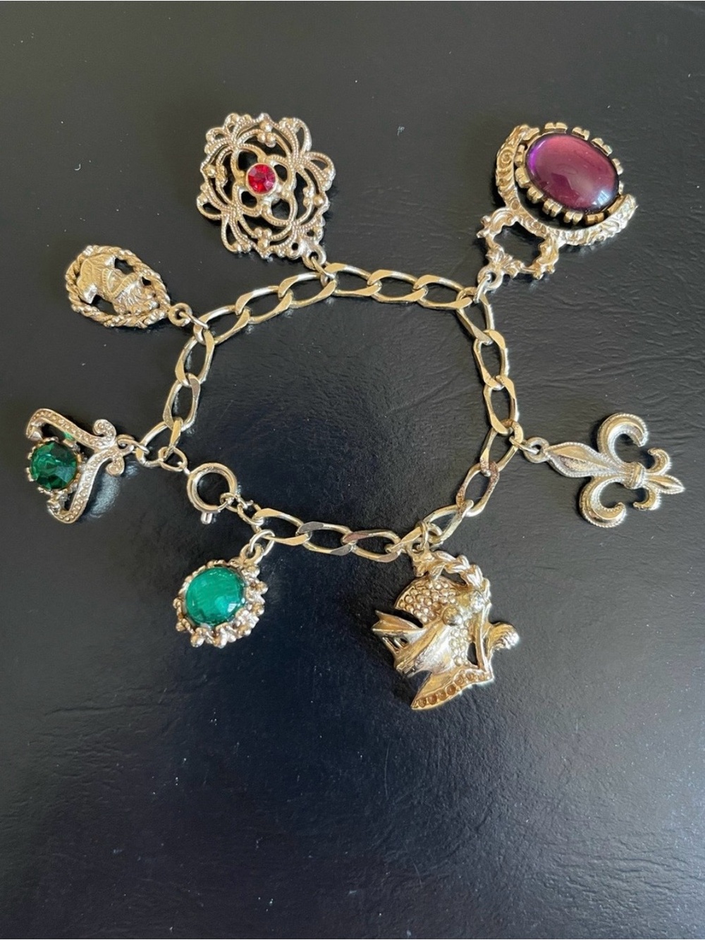 Vintage gold tone Fleur De Lis rhinestoneCharm Bracelet.